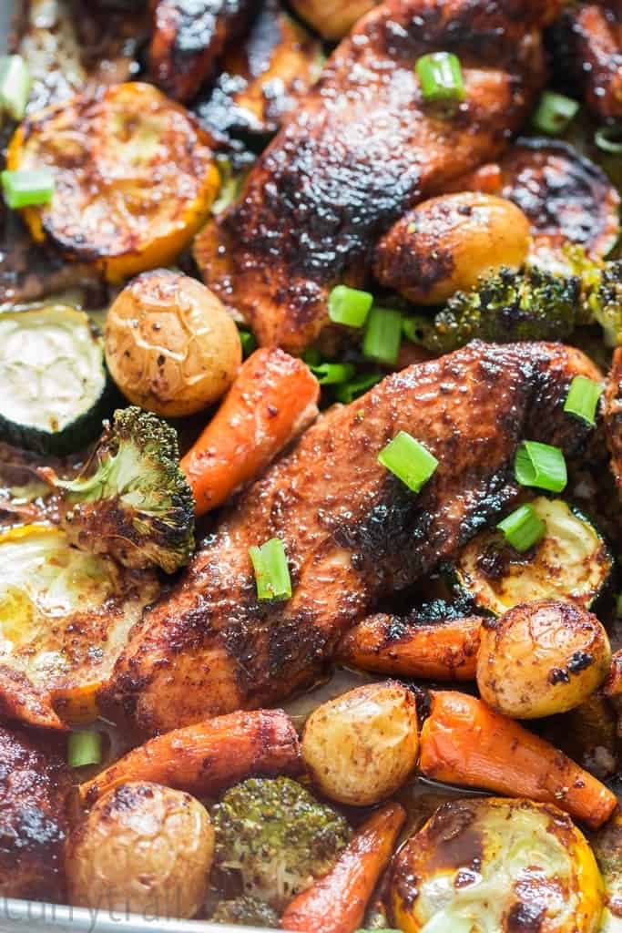 Oven cooked teriyaki sheet pan chicken with vegetables on a baking sheet