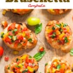 Wooden platter with fresh tomato bruschetta lined up