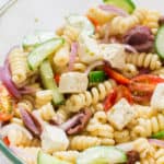 Greek pasta salad with text overlay