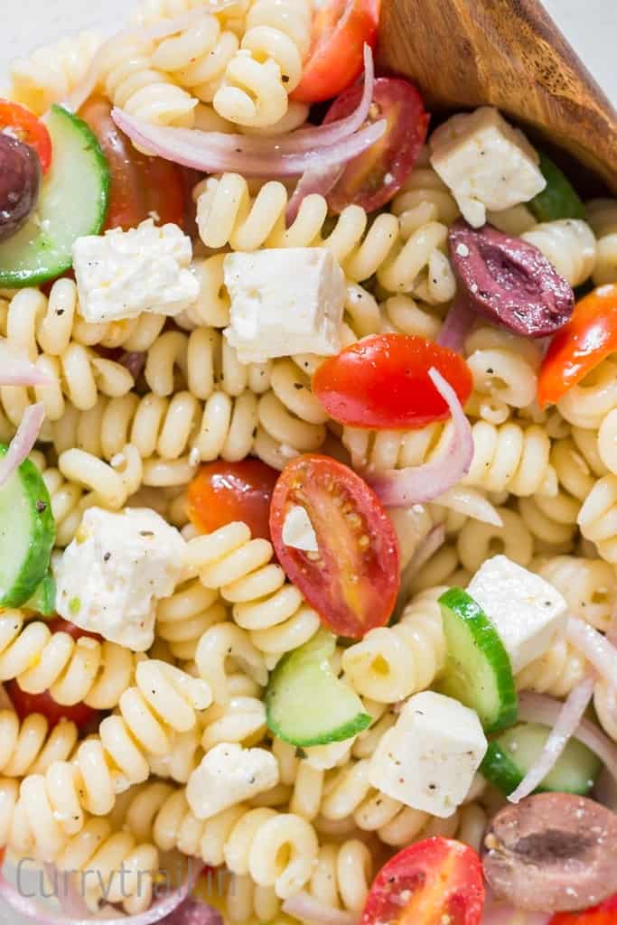 close up of pasta salad with feta and olives