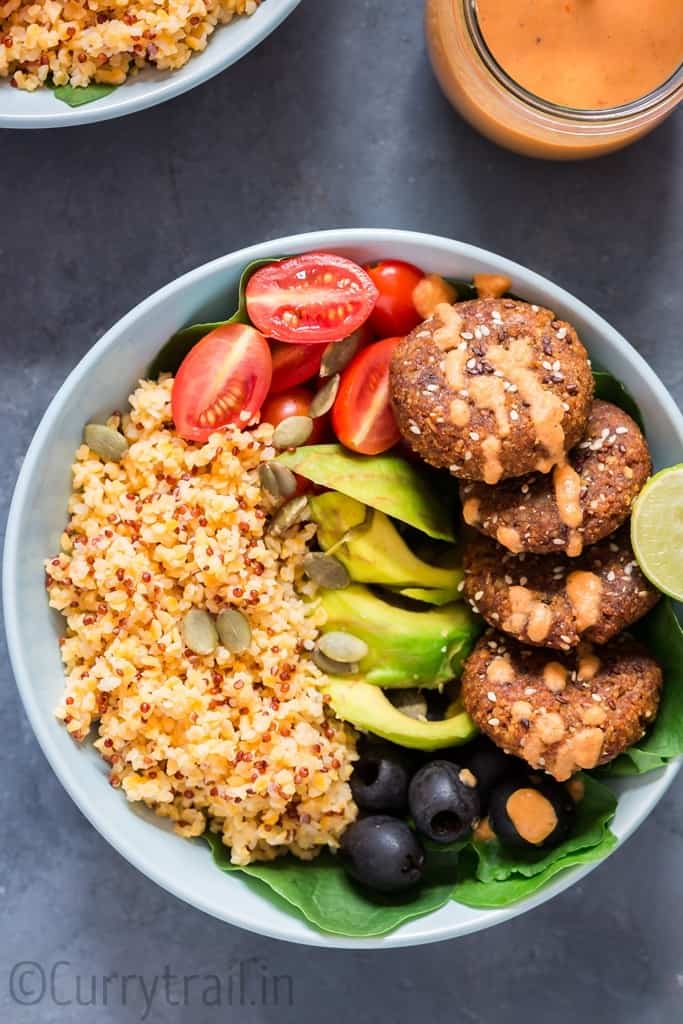 Mediterranean Vegan Buddha Bowl served in blue ceramic bowls