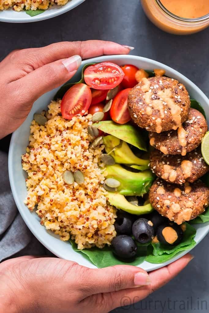 picking up a Mediterranean Vegan Buddha Bowl 