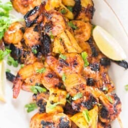 Teriyaki grilled pineapple shrimp skewers – a FAST and EASY finger food appetizer with great ASIAN flavors that can go easily on a meal prep box alongside some rice. There is a perfect shrimp skewers marinade in this recipe to jazz up the pineapple and shrimps.