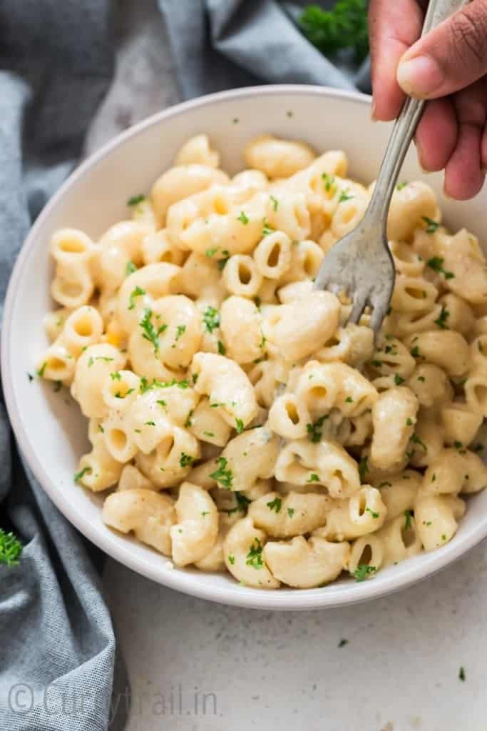 picking instant pot macaroni and cheese with fork