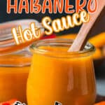spicy mango habanero hot sauce in glass jar with wooden spoon with text overlay