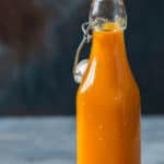 habanero and mango hot sauce in bottle with text overlay