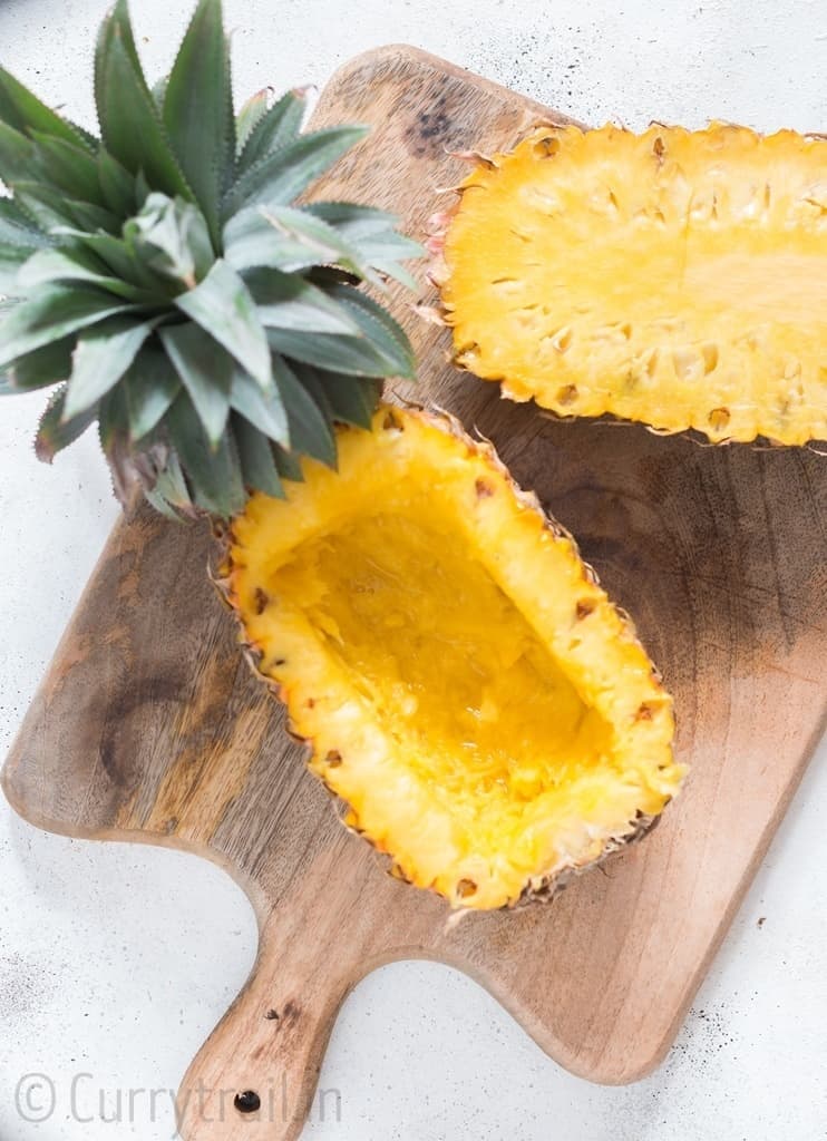 Fresh pineapple cut half into pineapple bowl