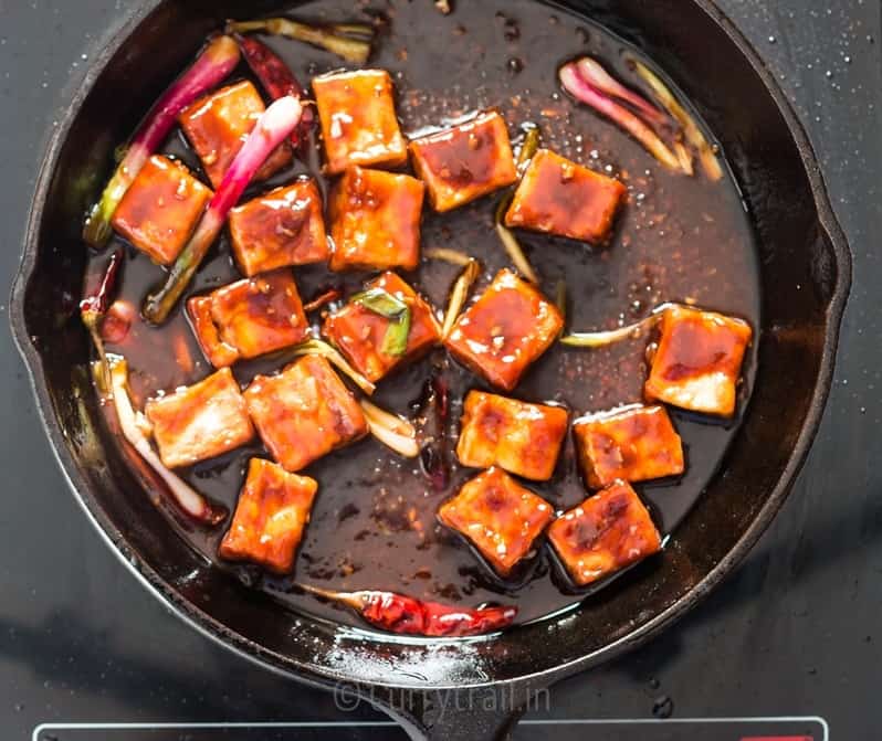 general tso's tofu cooked in cast iron pan