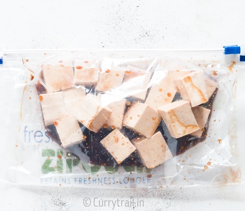 prep for general tso's tofu with tofu cubes marinated in sauce