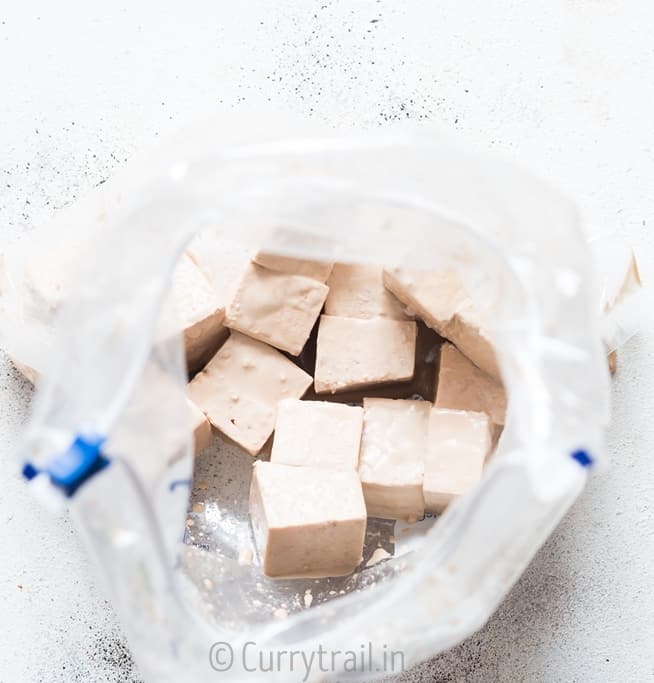 prep for general tso's tofu with tofu cubes mixed with corn flour