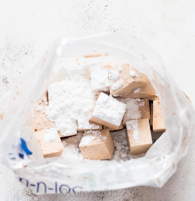 prep for general tso's tofu with tofu cubes mixed with corn flour