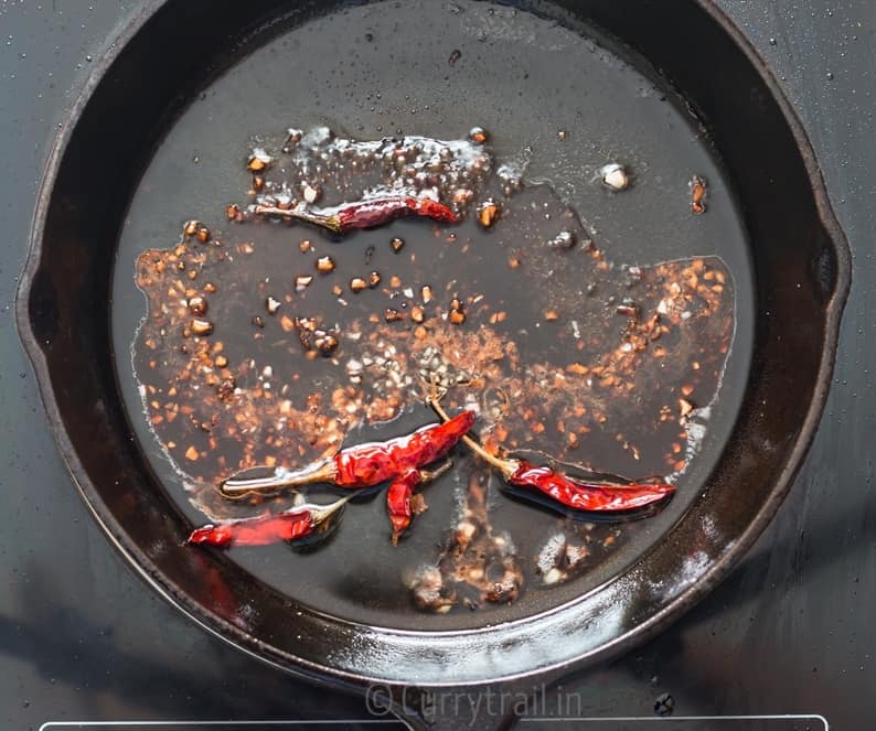 dried red chilies and ginger garlic fried in oil for general tso's tofu