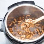 boiled peanuts cooked in instant pot with salt and chili flakes with text