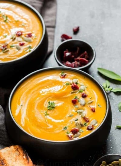 instant pot butternut squash soup served in 2 black bowl