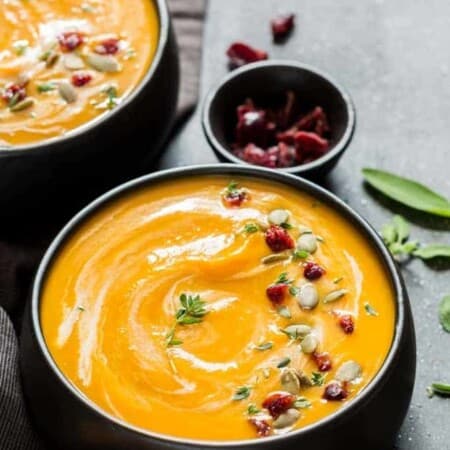 instant pot butternut squash soup served in 2 black bowl