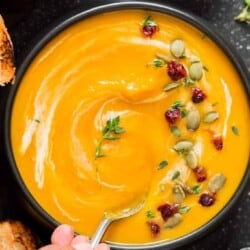 instant pot butternut squash soup served in black bowl with spoon