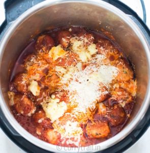 Instant pot chicken Parmesan meatballs with cheese melted on top