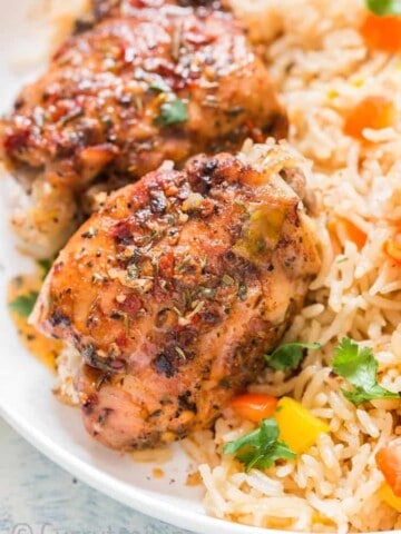 cajun spiced instant pot chicken and rice served on white plate