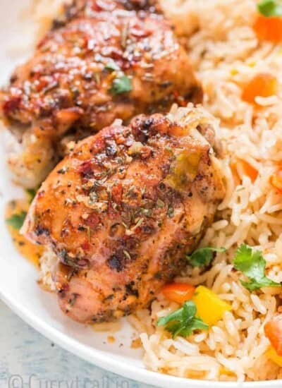 cajun spiced instant pot chicken and rice served on white plate