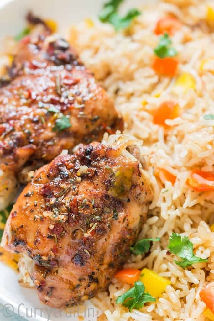 close up view of cajun spiced chicken thighs cooked in instant pot with rice