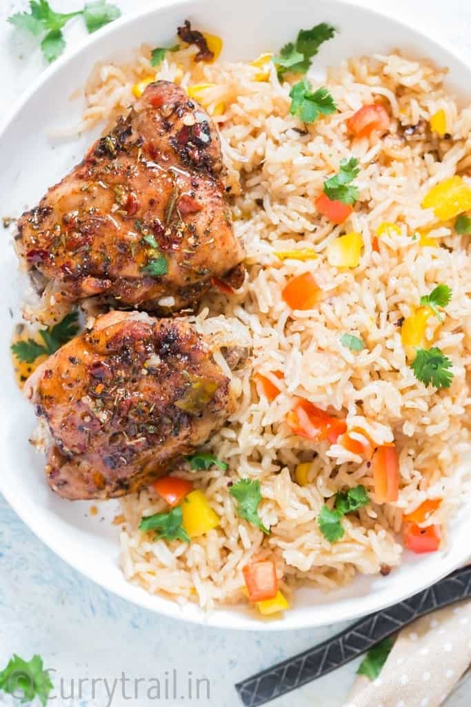 cajun flavored instant pot chicken and rice on white plate