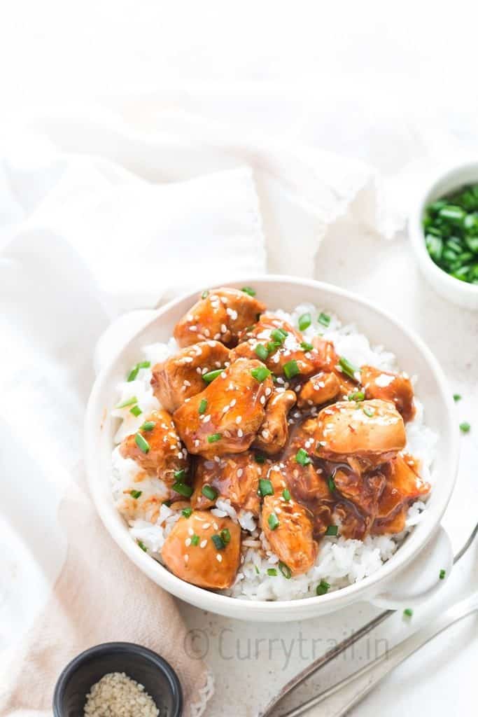a bowl of instant pot General Tso chicken over white rice
