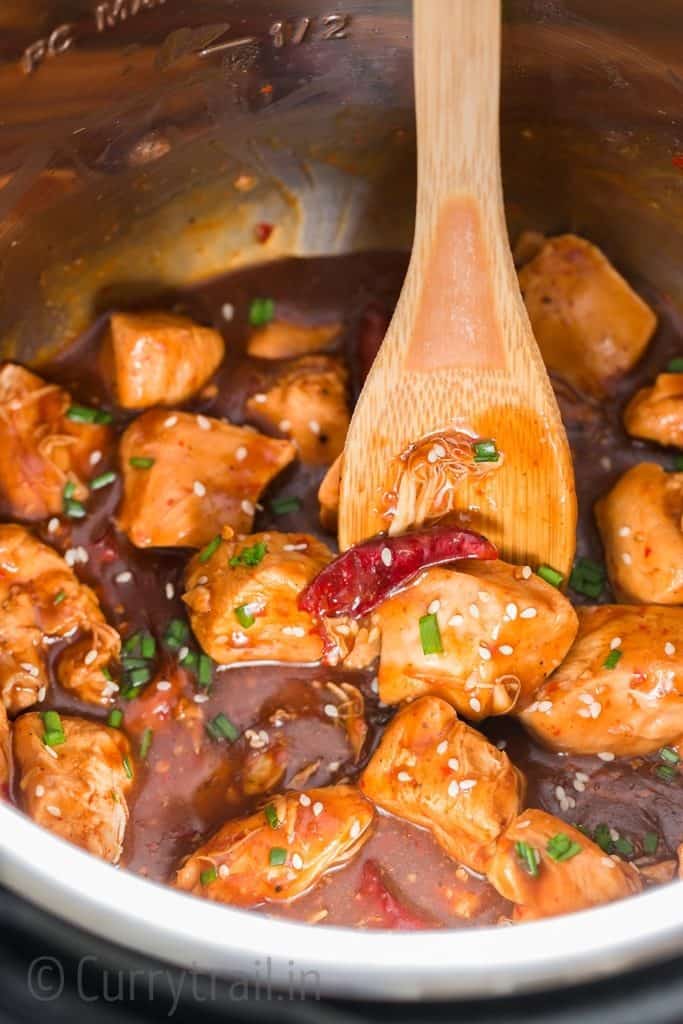 spicy instant pot General Tso chicken with spatula