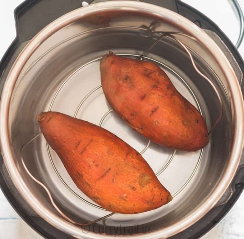 prep work for instant pot sweet potatoes two sweet potatoes placed in instant pot