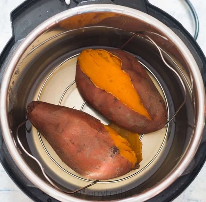 two steamed sweet potatoes placed in instant pot