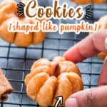 pumpkin cookies shaped like pumpkin on wire rack with text