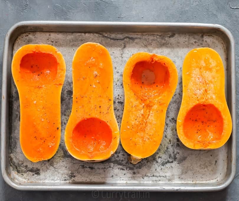 Sprinkled olive oil, salt and pepper for roasting butternut squash