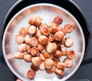 Sausages cooked in cast iron pan