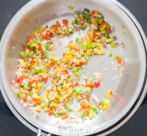 3 colored bell peppers in pan for cooking quinoa stuffed butternut squash