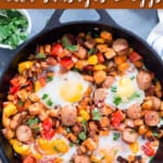 sweet potato hash with sausages and eggs with text