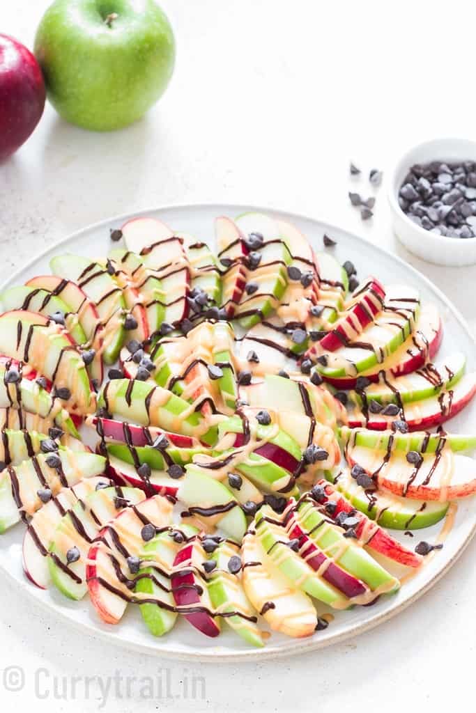 apple and peanut butter nachos sprinkled with choco chips