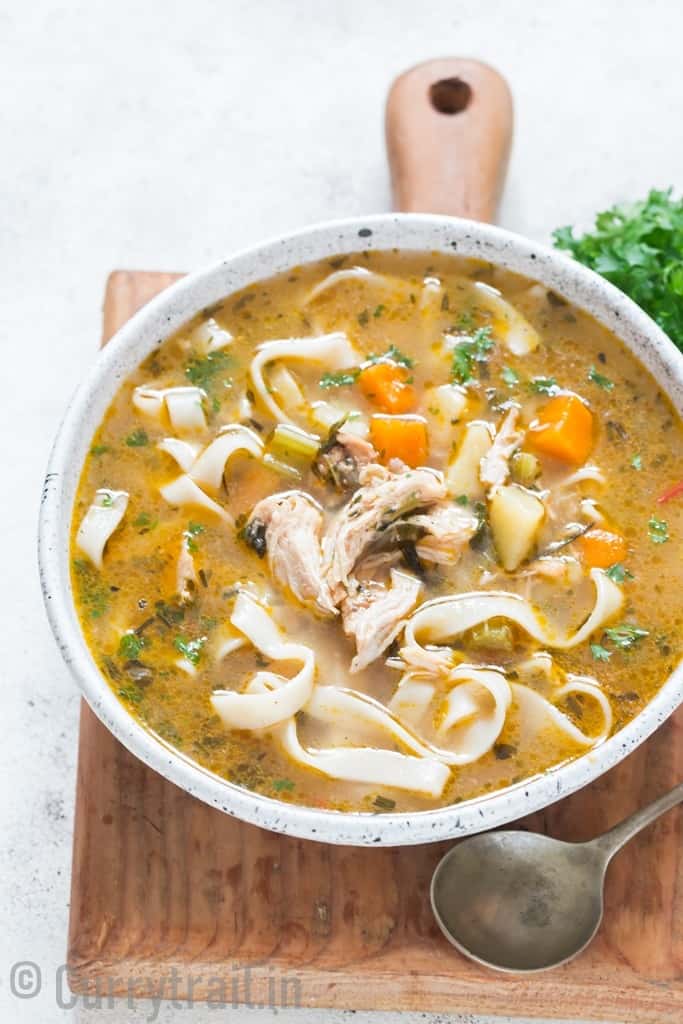 instant pot chicken noodles soup in white bowl