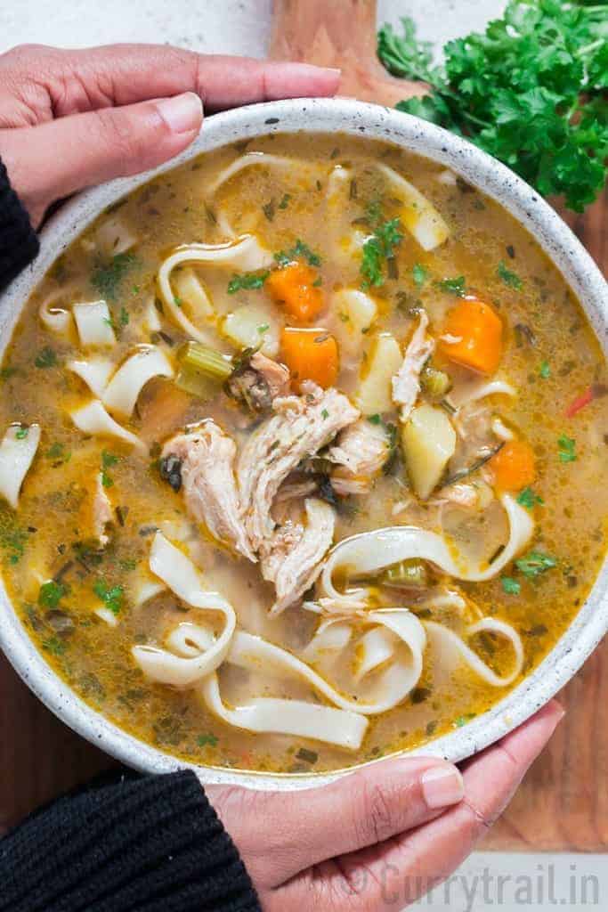 instant pot chicken noodles soup in white bowl