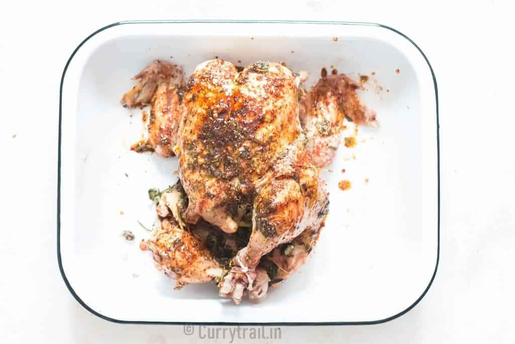 whole chicken cooked in an instant pot rubbed with spice rub for broiling.