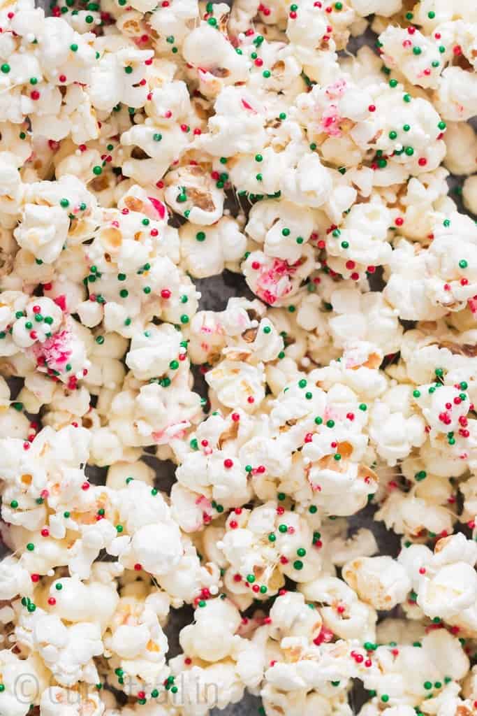 Santa munch Christmas popcorn snack mix is baking tray 