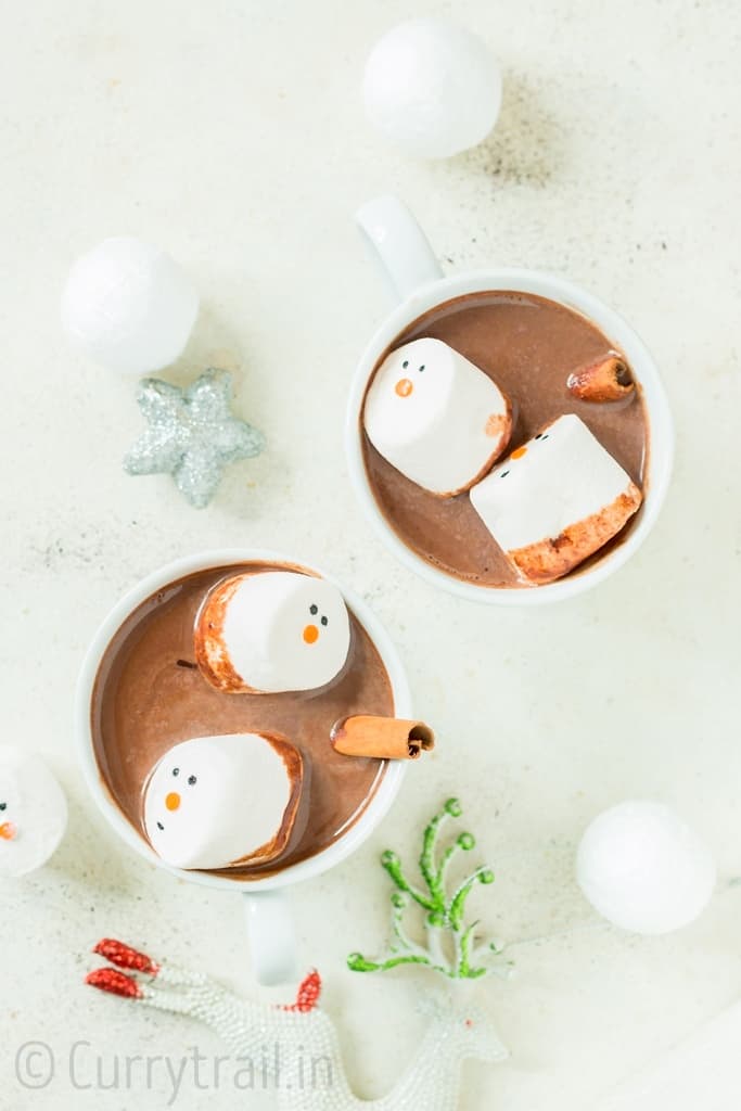 Homemade hot chocolate mix topped with marshmallows and cinnamon