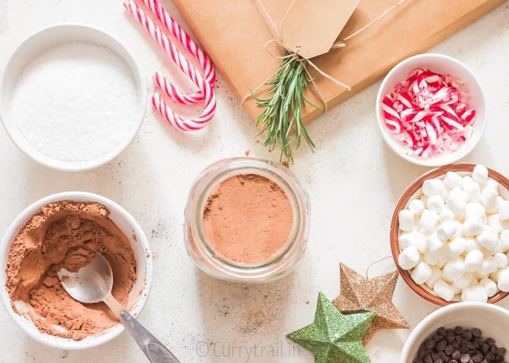 add a measured amount of premium cocoa powder on top of powdered sugar to the mason jar.