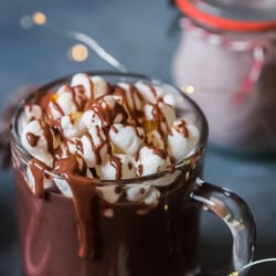 hot chocolate in a cup with a mini marshmallow.