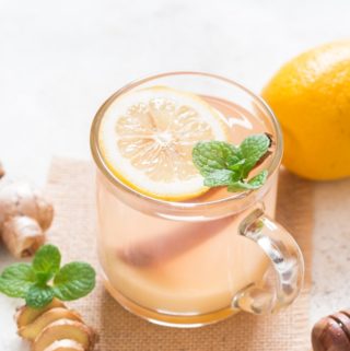 honey lemon ginger tea served in glass mug is soothing and refreshing drink that helps you fight cold and flu. It helps detox and calm you down during stress