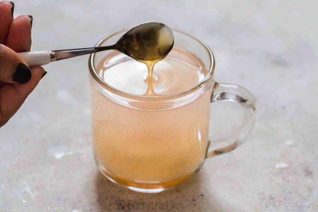 honey lemon ginger tea served in glass mug is soothing and refreshing drink that helps you fight cold and flu. It helps detox and calm you down during stress