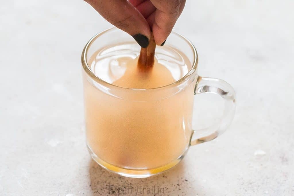 honey lemon ginger tea served in glass mug is soothing and refreshing drink that helps you fight cold and flu. It helps detox and calm you down during stress