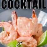 spicy prawn cocktail in martini glasses with lime wedges with text overlay