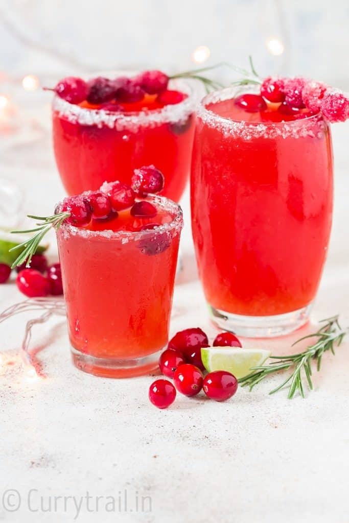 cranberry margaritas in 3 serving glasses