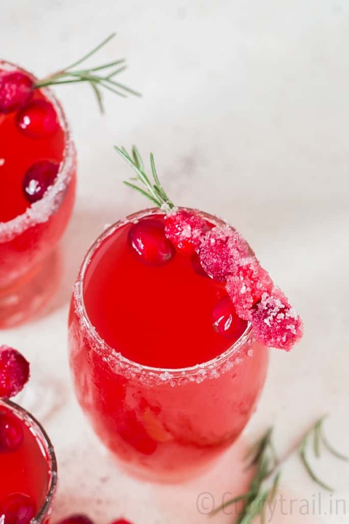 cranberry margaritas in 3 serving glasses