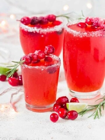 cranberry margaritas in 3 serving glasses