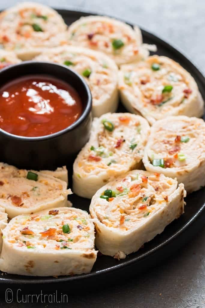 Chicken enchilada tortilla roll-ups are perfect appetizers for game day, parties or any gatherings that you can put together easily